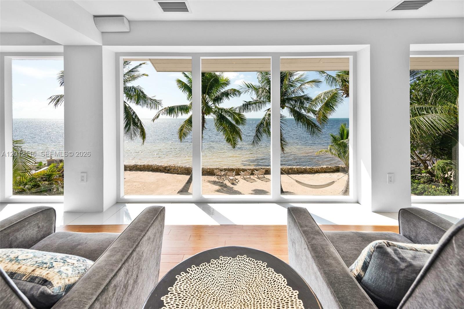 60 Ocean Front Drive Key Largo, FL 33037 - Photo 49 of 85 a living room with furniture and a large window