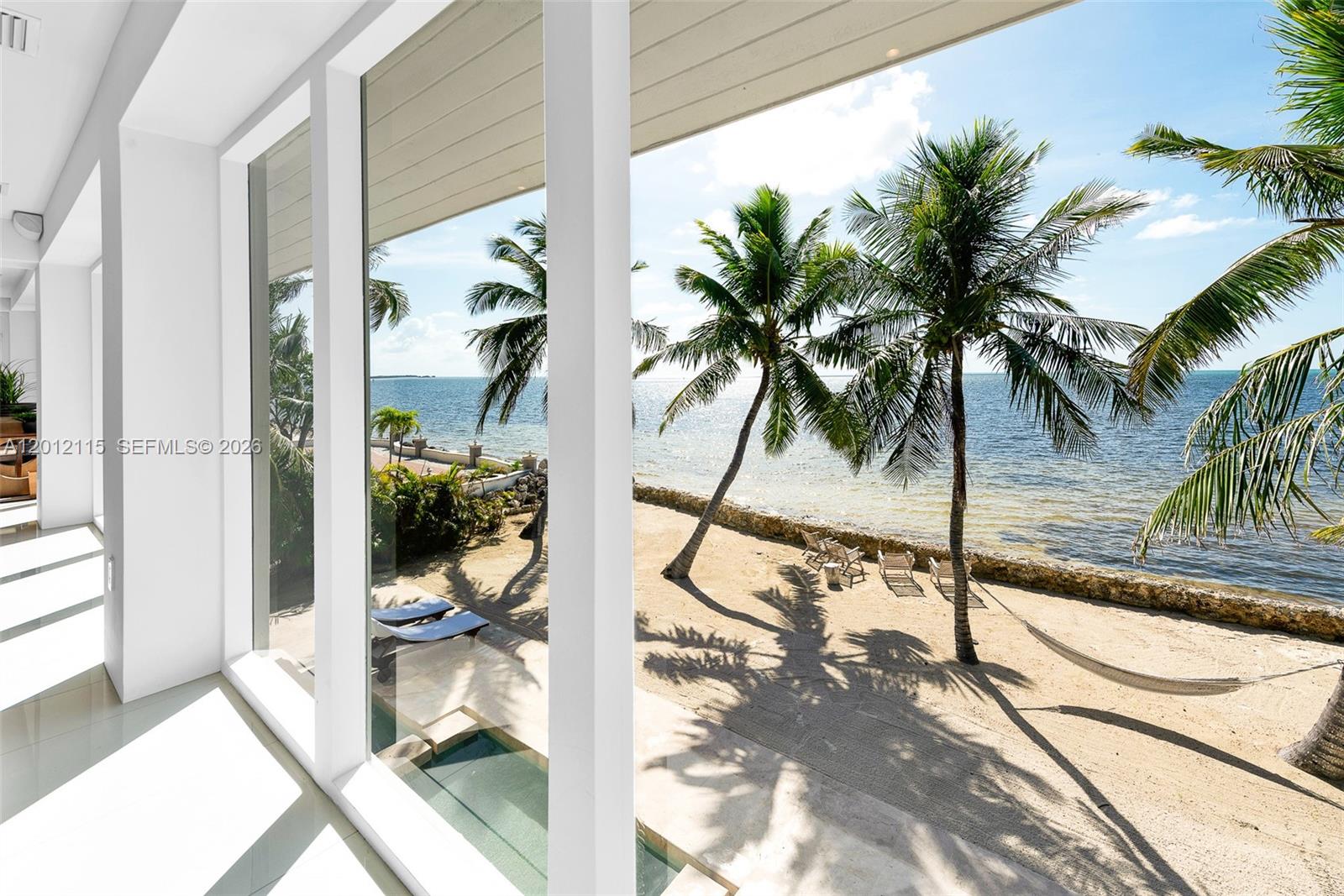 60 Ocean Front Drive Key Largo, FL 33037 - Photo 50 of 85 a view of a backyard of a house