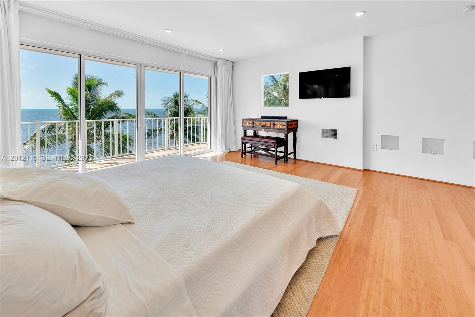60 Ocean Front Drive Key Largo, FL 33037 - Photo 75 of 85 a living room with furniture and a flat screen tv