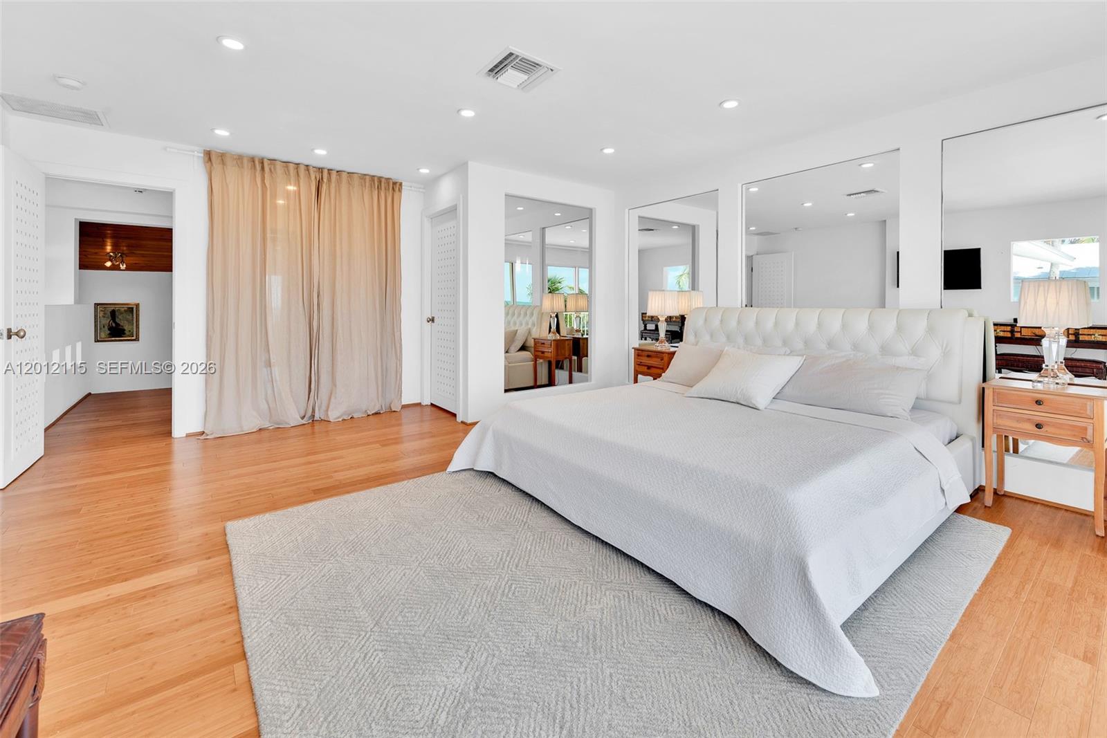 60 Ocean Front Drive Key Largo, FL 33037 - Photo 76 of 85 a bedroom with a large bed and furniture