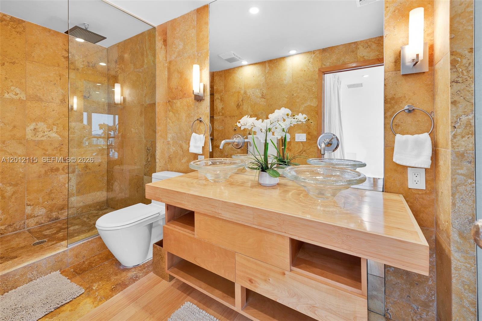 60 Ocean Front Drive Key Largo, FL 33037 - Photo 78 of 85 a bathroom with a double vanity sink toilet and shower