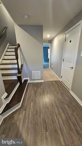 a view of backyard with plants and outdoor seating