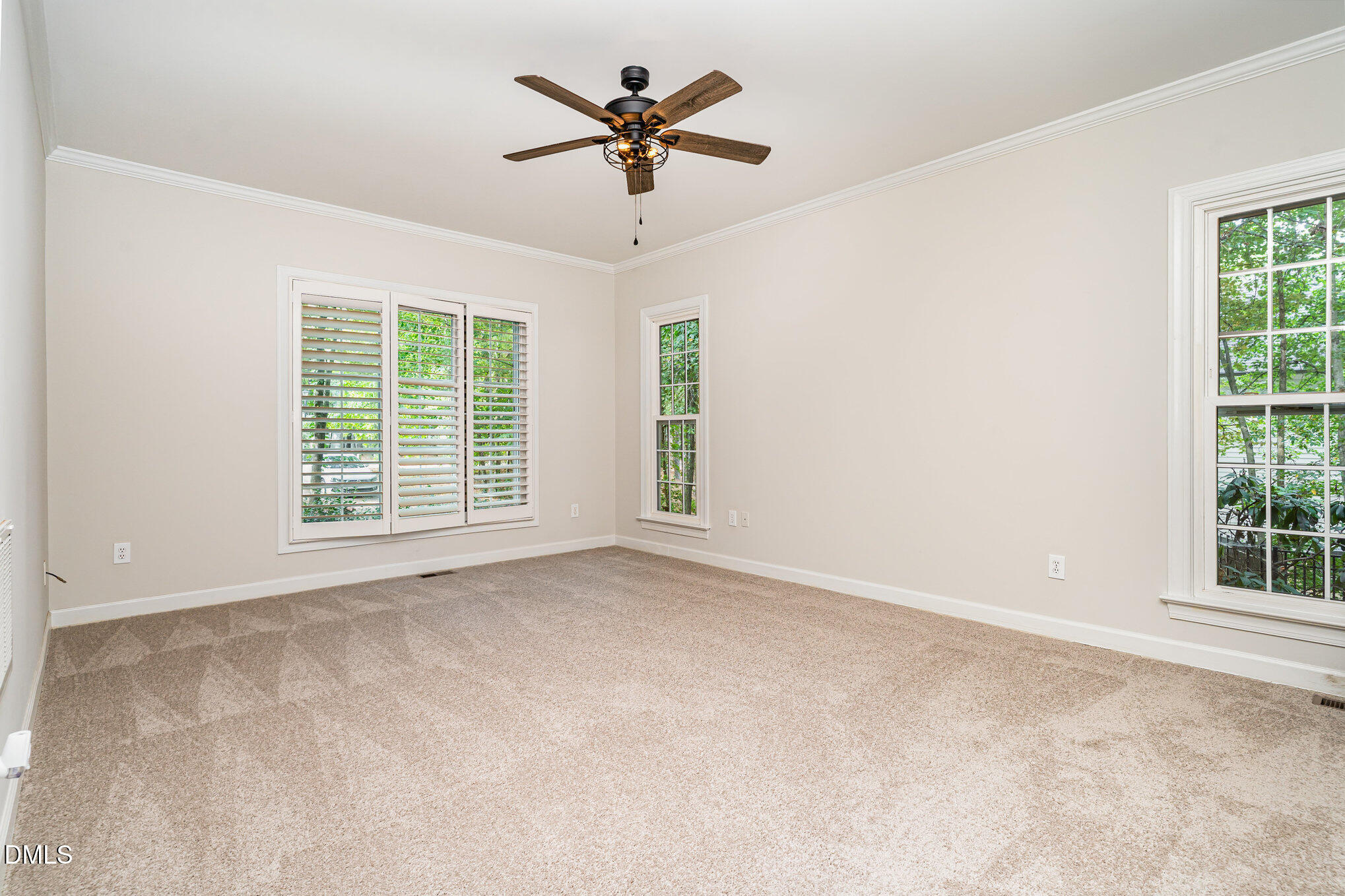 2425 Welsh Tavern Way Wake Forest, NC 27587 - Photo 11 of 34 an empty room with window and a ceiling fan