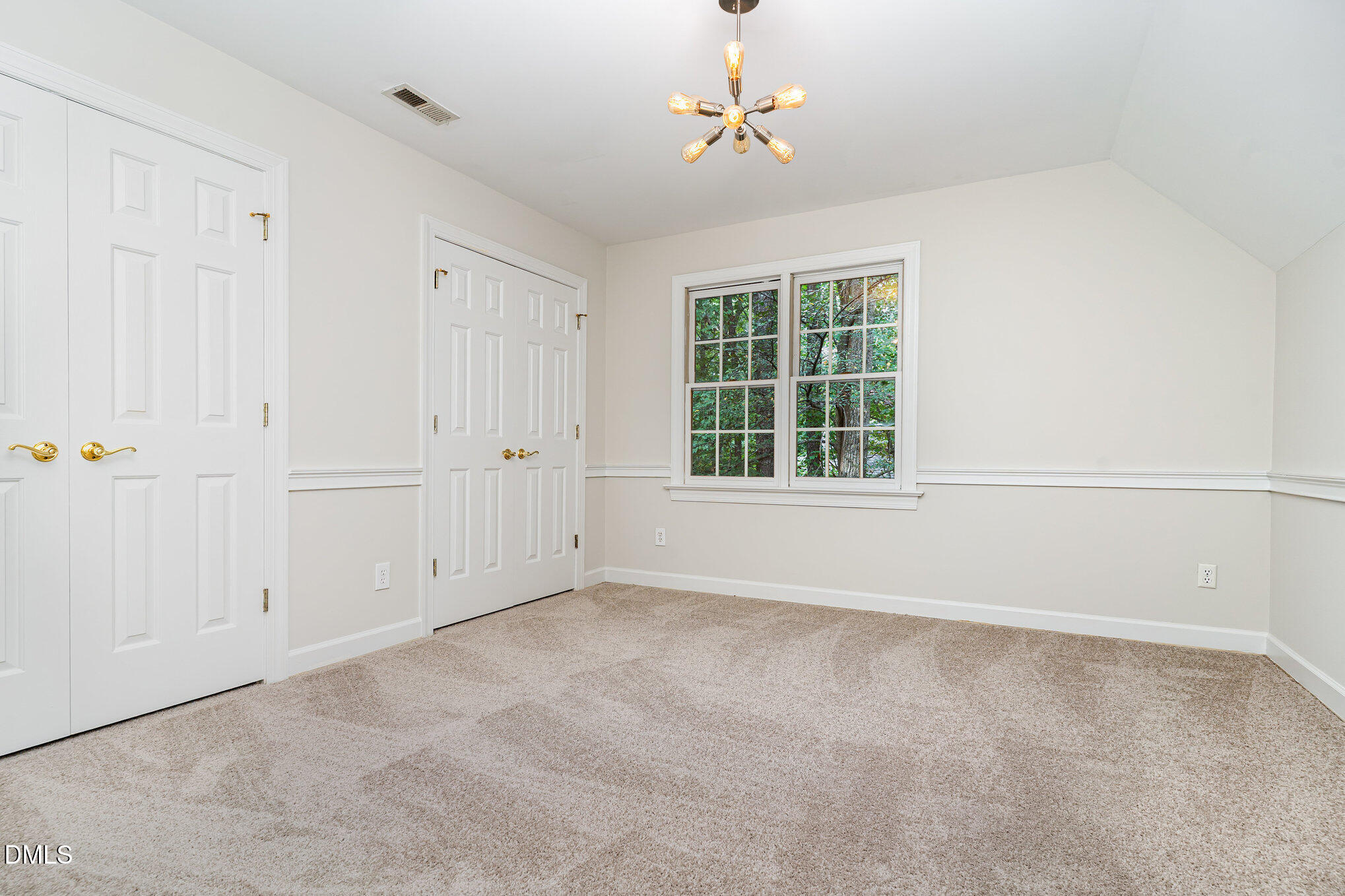 2425 Welsh Tavern Way Wake Forest, NC 27587 - Photo 13 of 34 an empty room with windows and cabinet
