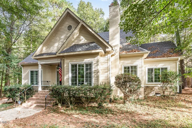 a front view of house with yard and outdoor seating