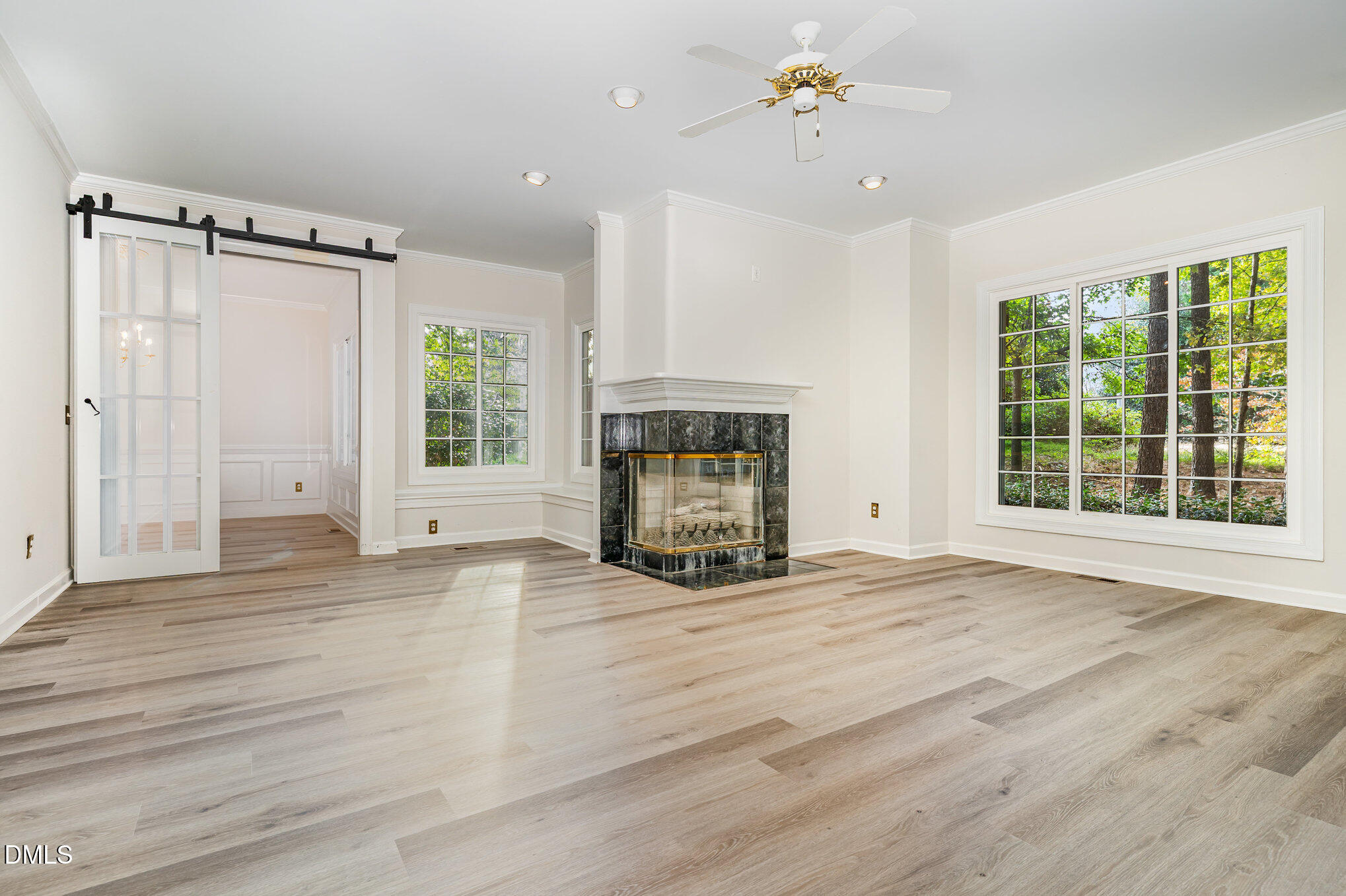 2425 Welsh Tavern Way Wake Forest, NC 27587 - Photo 5 of 34 a view of an empty room with a fireplace and a window