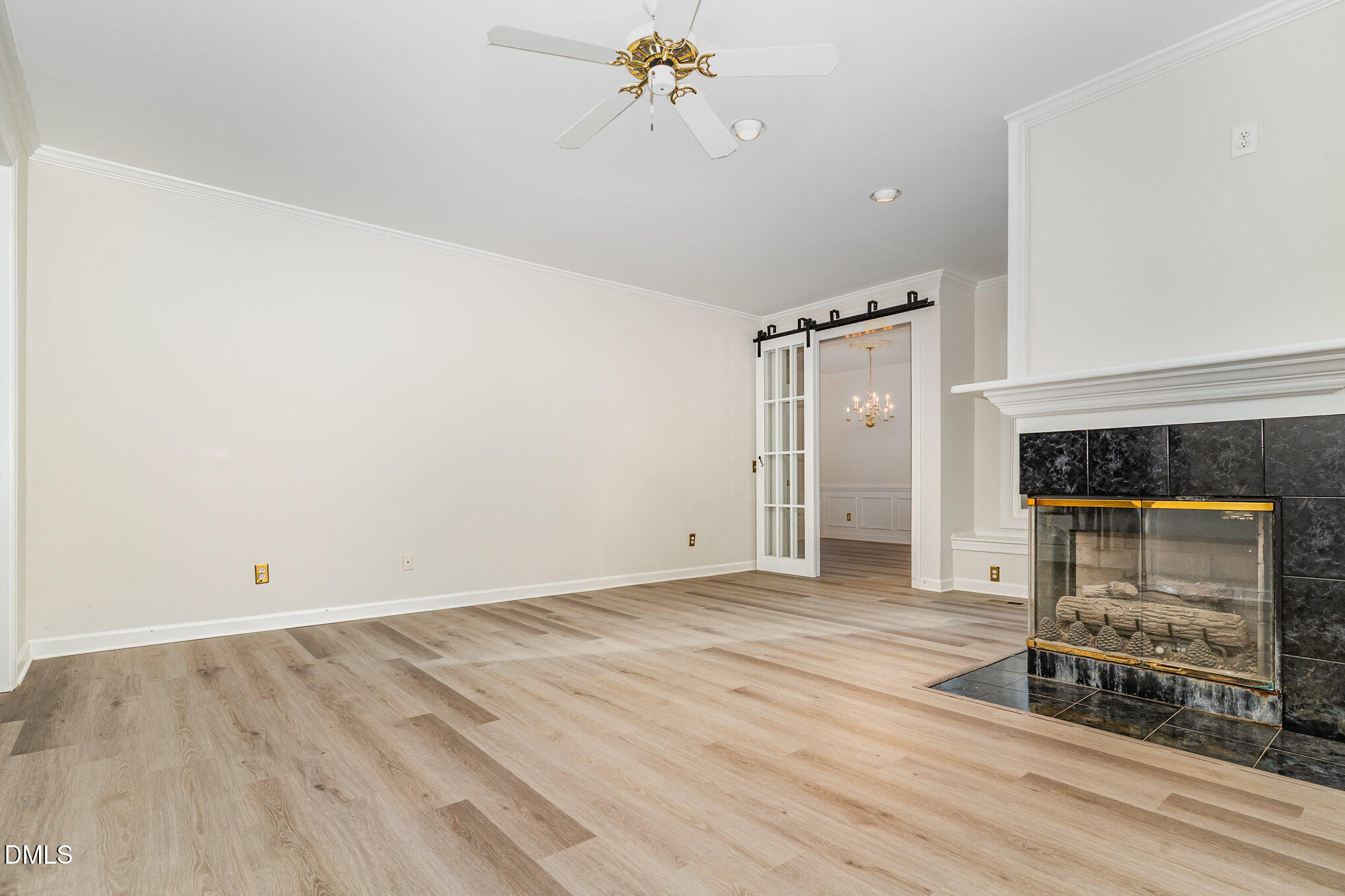 2425 Welsh Tavern Way Wake Forest, NC 27587 - Photo 6 of 34 wooden floor in an empty room with a fireplace