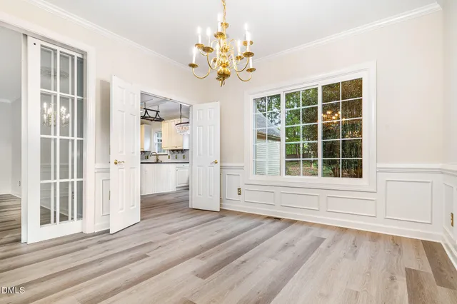 wooden floor in an empty room with a fireplace