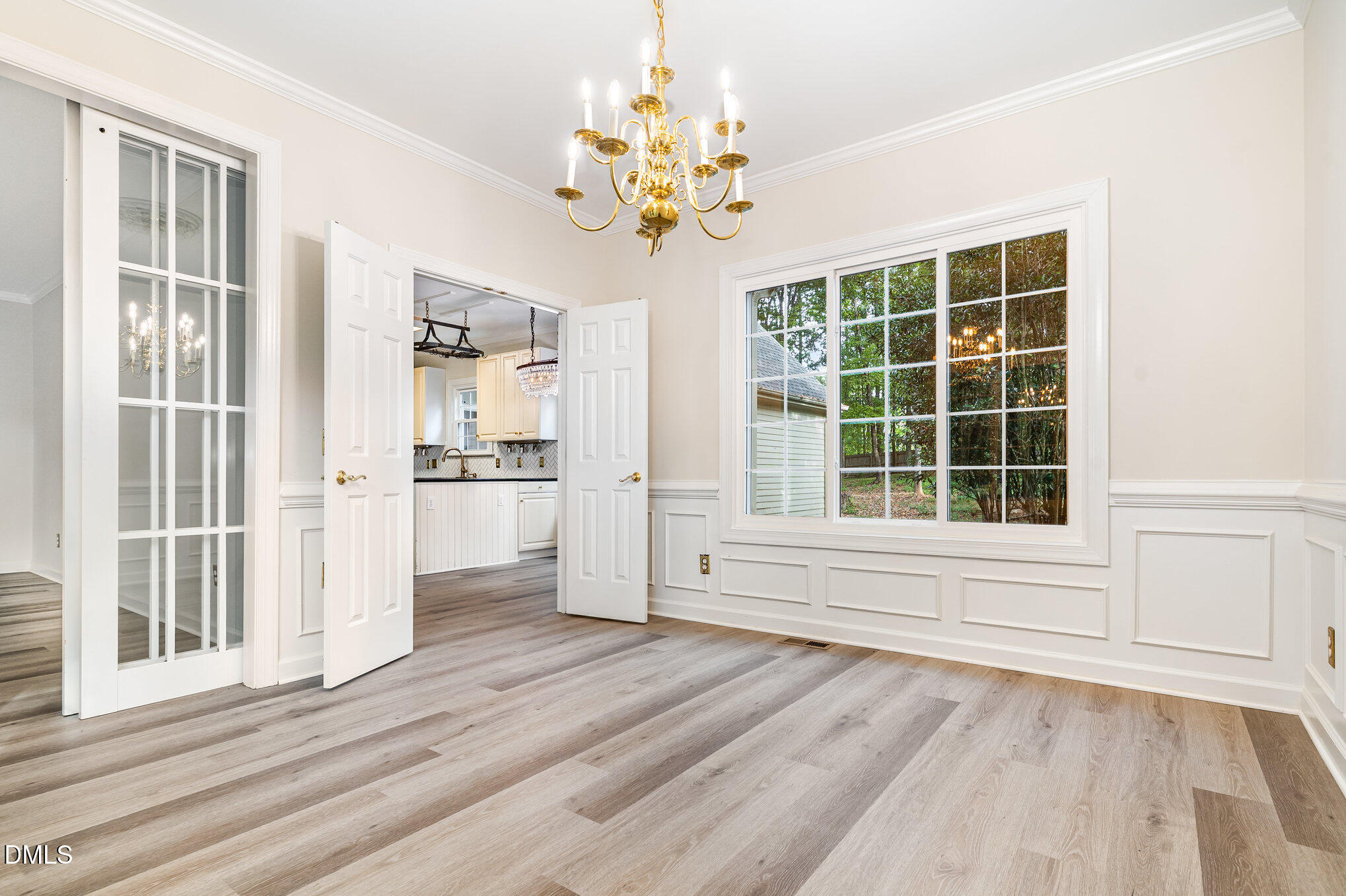 2425 Welsh Tavern Way Wake Forest, NC 27587 - Photo 7 of 34 a view of an empty room with a window and wooden floor