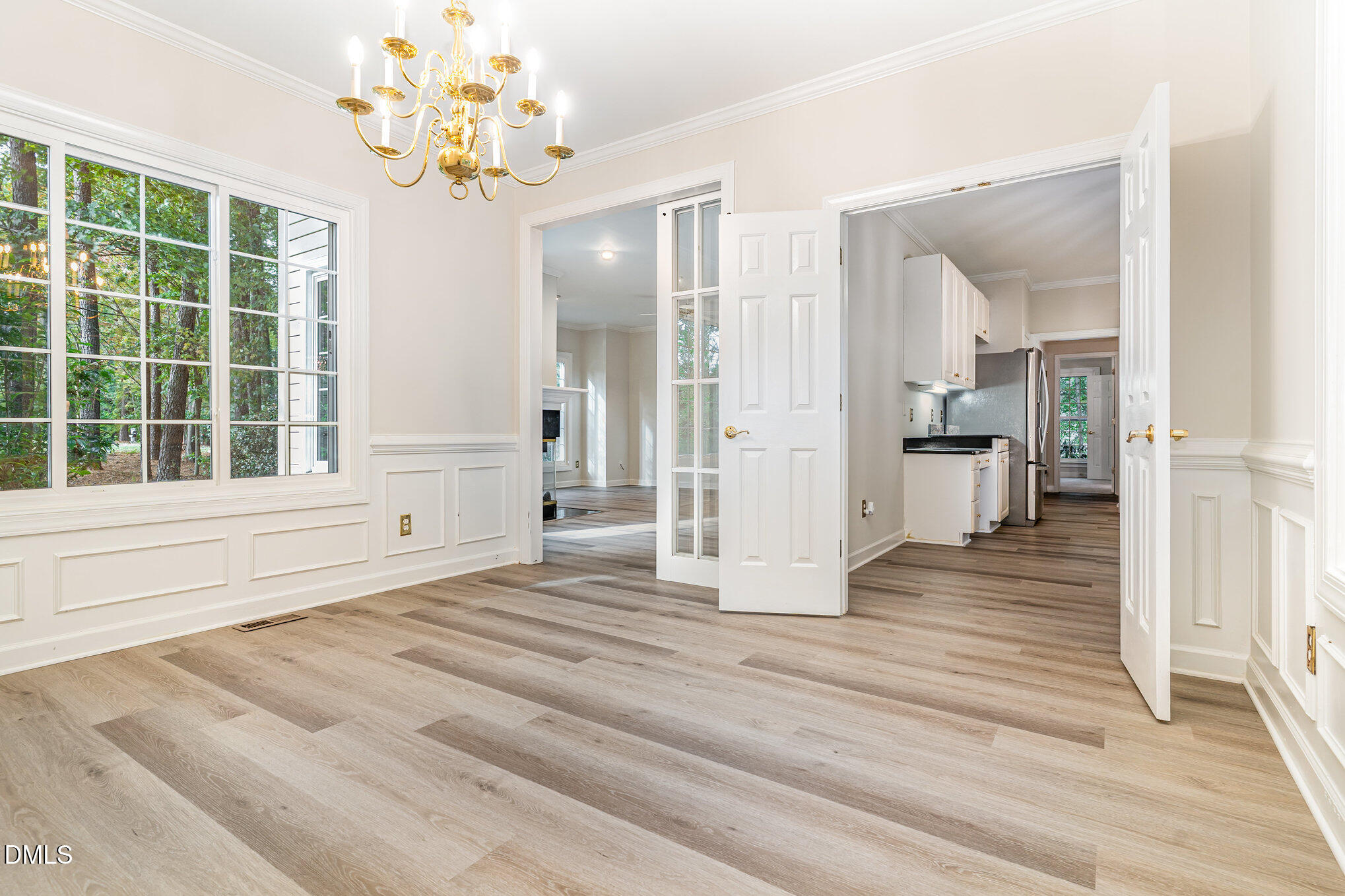 2425 Welsh Tavern Way Wake Forest, NC 27587 - Photo 8 of 34 a view of a bedroom with wooden floor and a large window