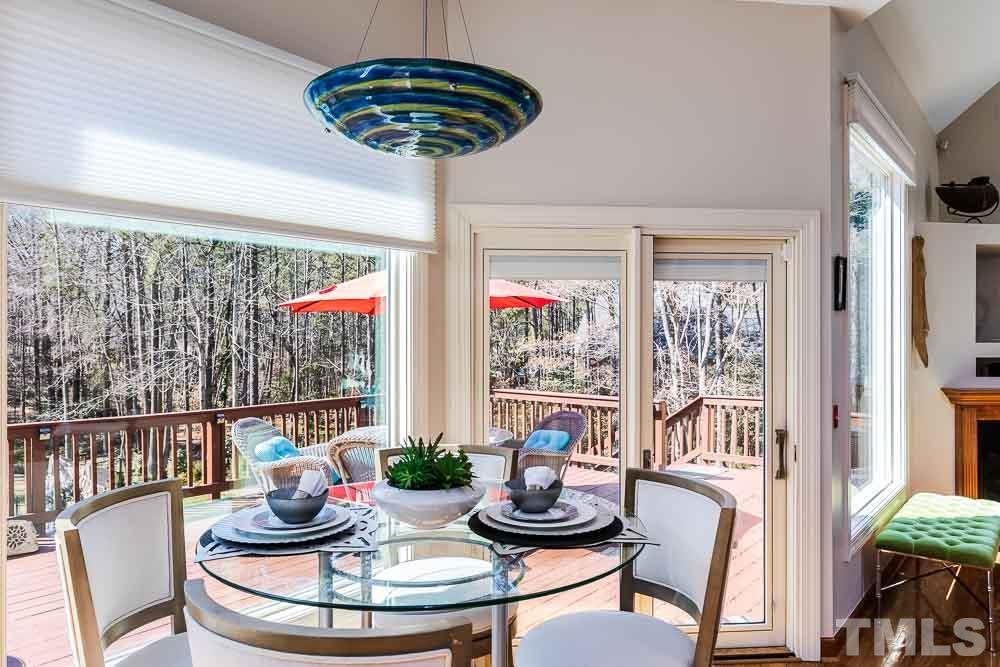 11437 John Allen Road Raleigh, NC 27614 - Photo 17 of 50 a dining room with furniture a chandelier and wooden floor