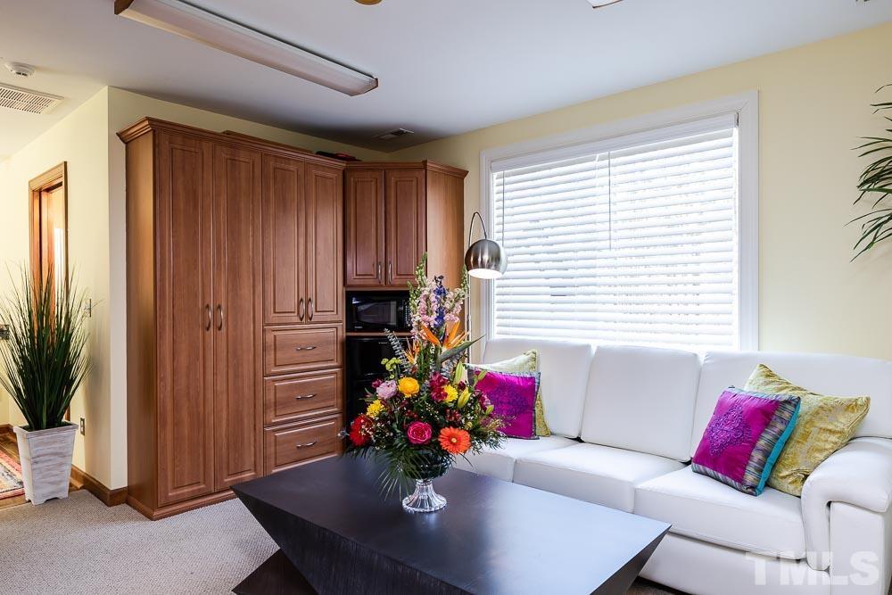 11437 John Allen Road Raleigh, NC 27614 - Photo 31 of 50 a living room with furniture and flowers