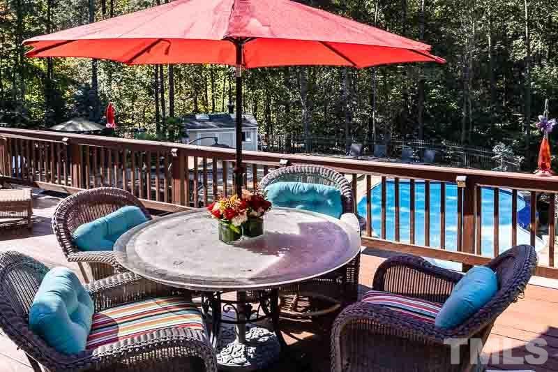 11437 John Allen Road Raleigh, NC 27614 - Photo 45 of 50 a view of balcony with furniture and umbrella