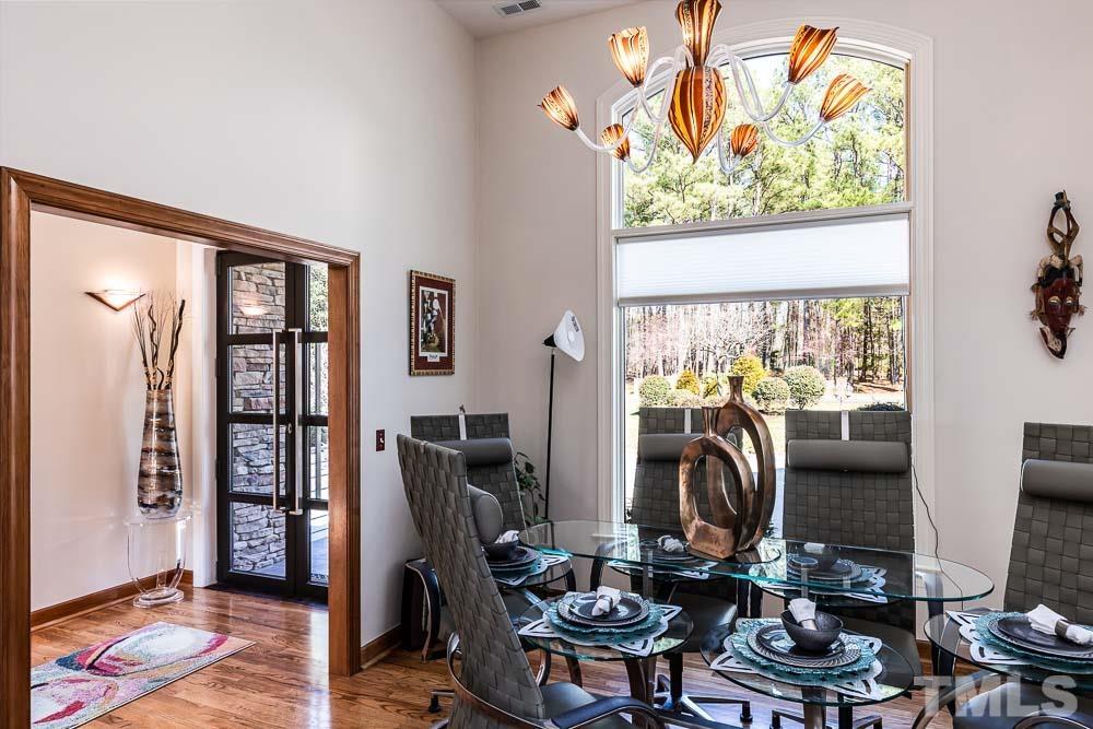 11437 John Allen Road Raleigh, NC 27614 - Photo 8 of 50 a work room with furniture and a floor to ceiling window