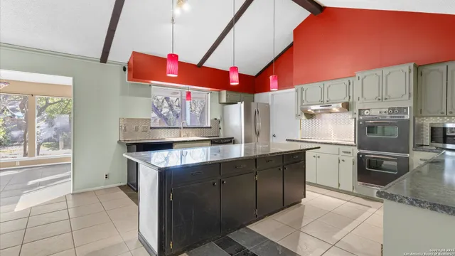 a kitchen with stainless steel appliances granite countertop a sink counter space and stainless steel appliances