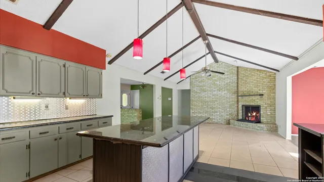 a kitchen with a sink and a refrigerator