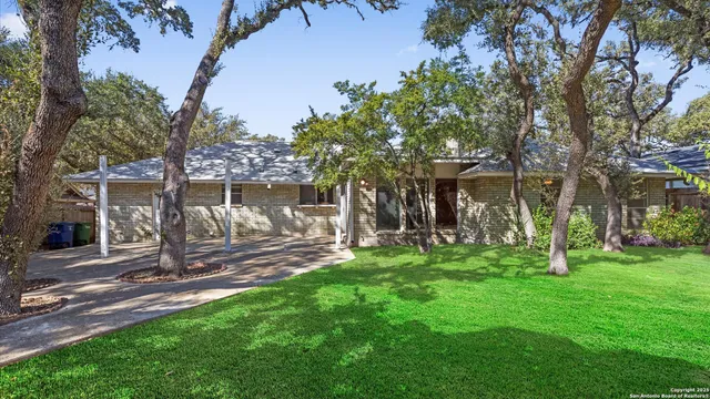 a view of a house with a yard porch and sitting area