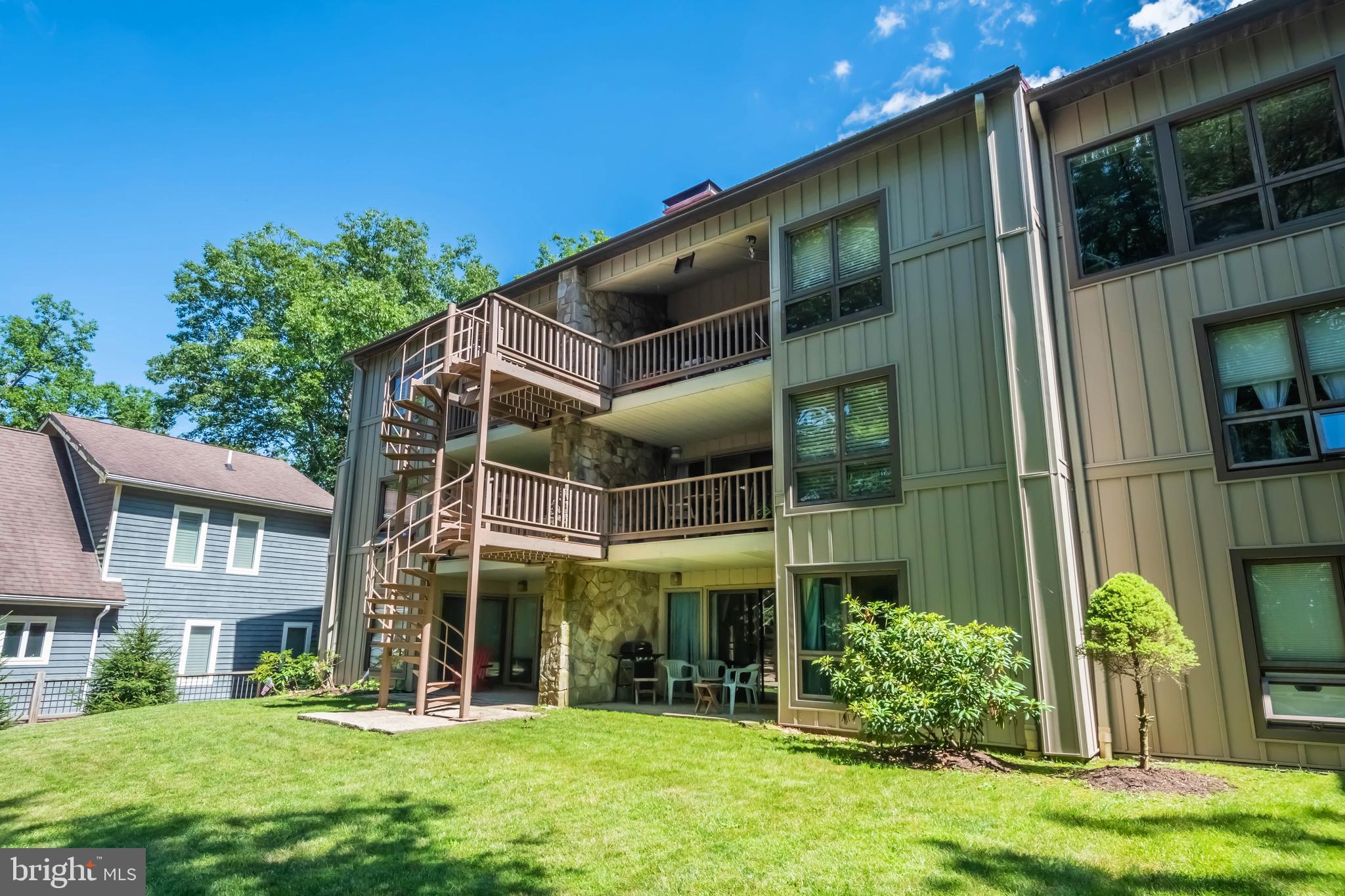 a view of a building with a yard