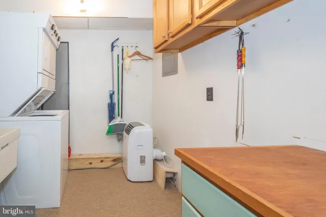 a room with pool table and window