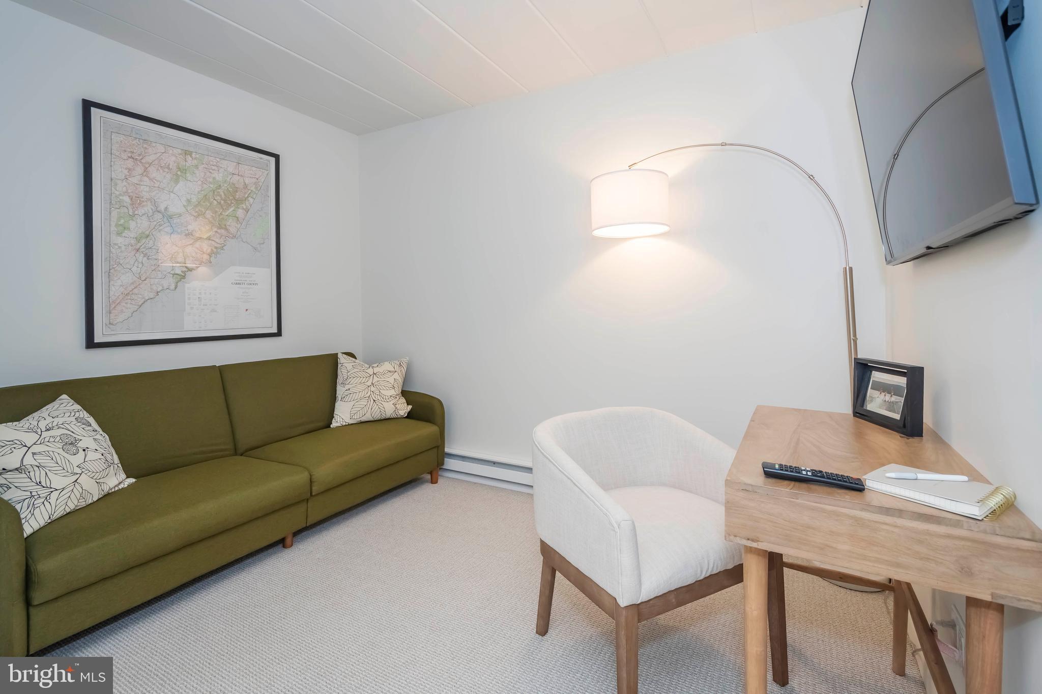 189 Red Run Road, Unit 1C2 Oakland, MD 21550 - Photo 18 of 50 a living room with furniture and a window