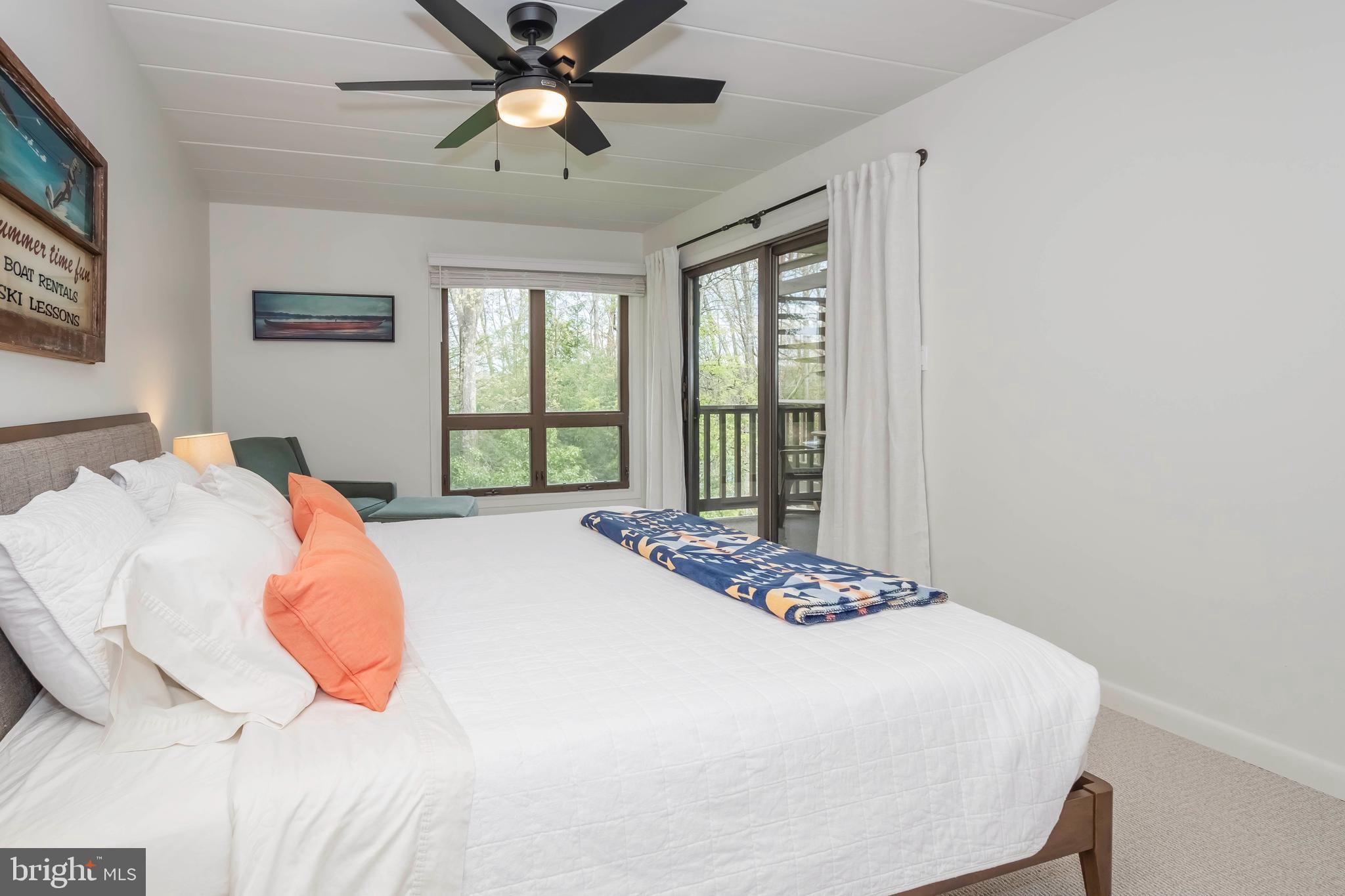 189 Red Run Road, Unit 1C2 Oakland, MD 21550 - Photo 20 of 50 a bedroom with a bed and a window