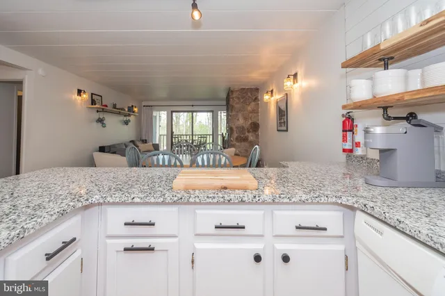 a view of a kitchen counter top space and cabinets
