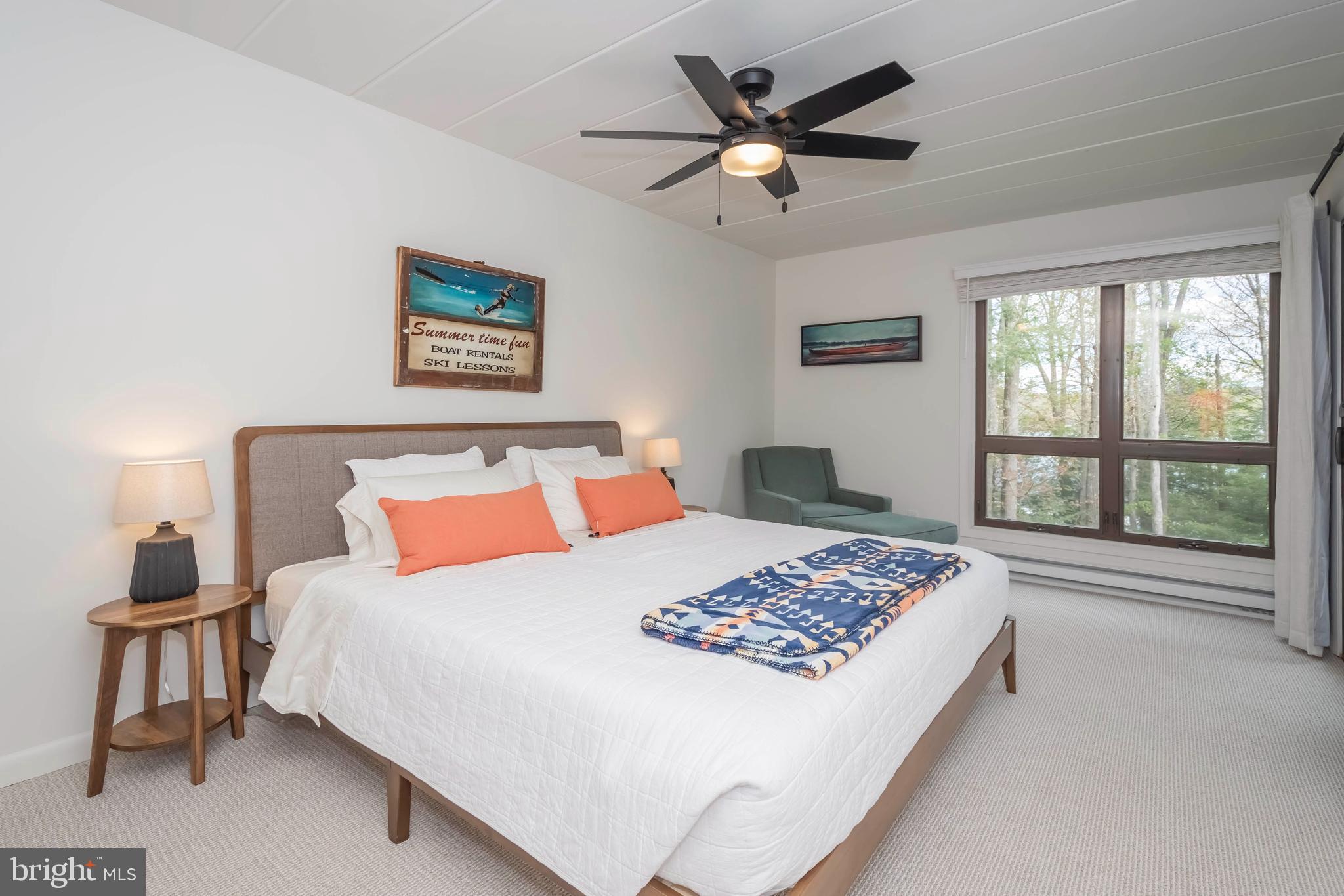 189 Red Run Road, Unit 1C2 Oakland, MD 21550 - Photo 21 of 50 a bedroom with a large bed and a window