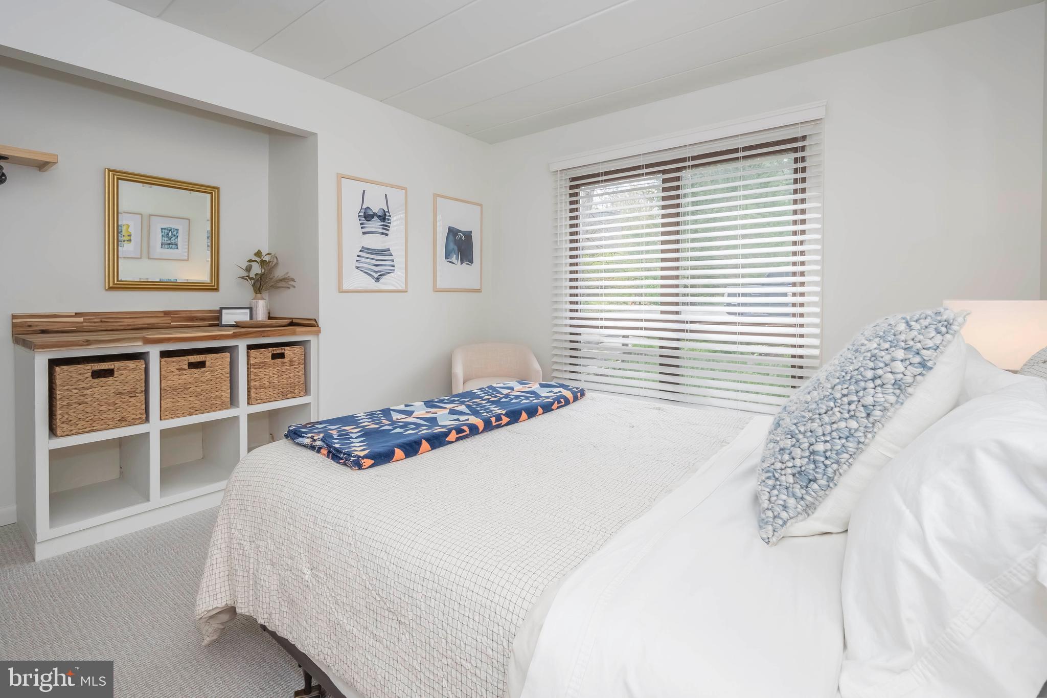 189 Red Run Road, Unit 1C2 Oakland, MD 21550 - Photo 22 of 50 a bedroom with a bed and a window