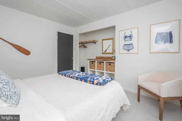 a bedroom with a bed and a chair