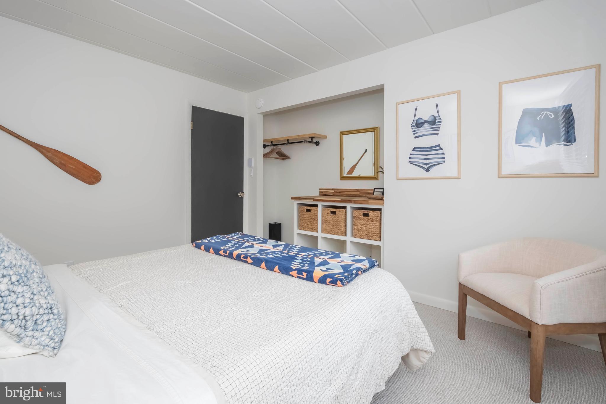 189 Red Run Road, Unit 1C2 Oakland, MD 21550 - Photo 23 of 50 a bedroom with a bed and a chair