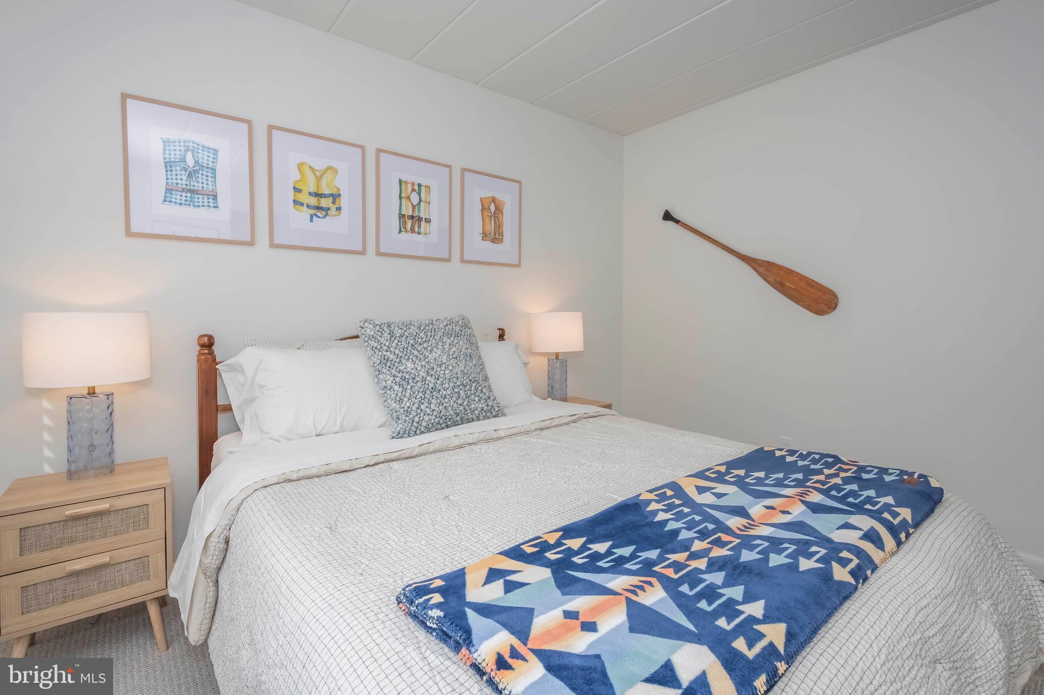 189 Red Run Road, Unit 1C2 Oakland, MD 21550 - Photo 24 of 50 a bedroom with bed and cupboard