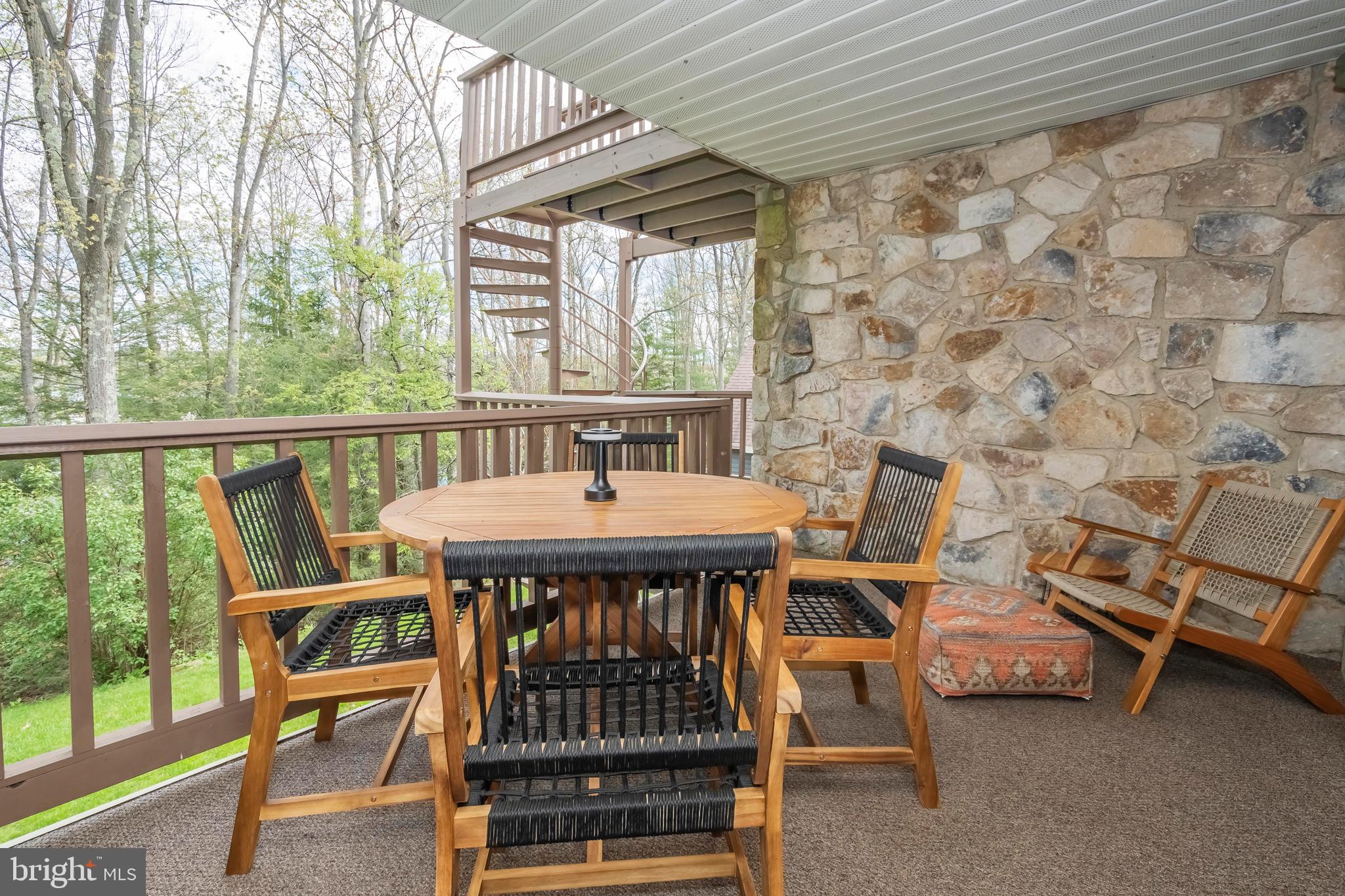 189 Red Run Road, Unit 1C2 Oakland, MD 21550 - Photo 27 of 50 a view of a patio with a table and chairs
