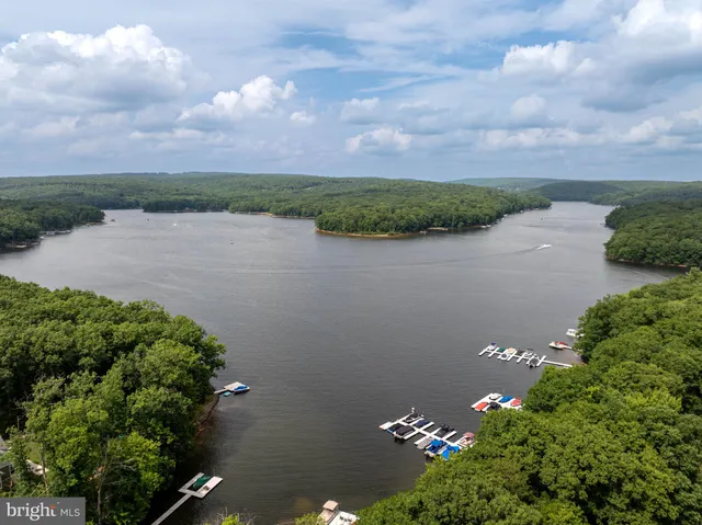 an aerial view of a houses with yard