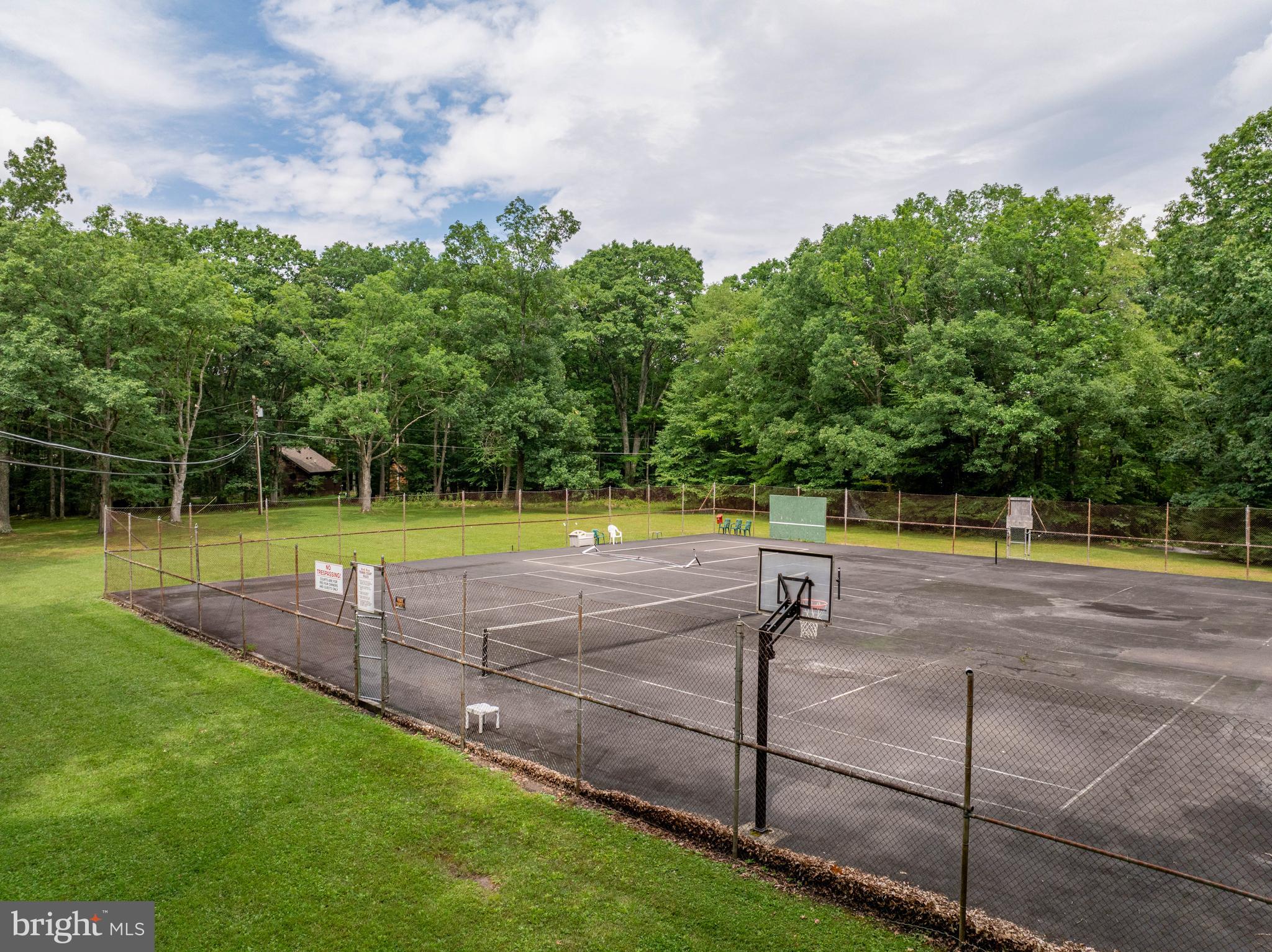 189 Red Run Road, Unit 1C2 Oakland, MD 21550 - Photo 34 of 50 a view of a swimming pool with a yard