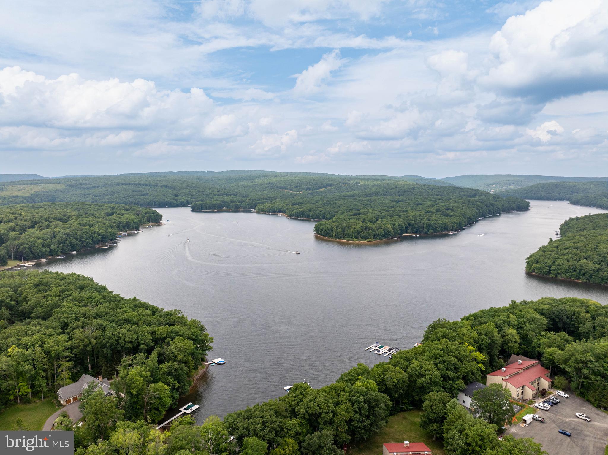 189 Red Run Road, Unit 1C2 Oakland, MD 21550 - Photo 41 of 50 an aerial view of lake and residential houses with outdoor space