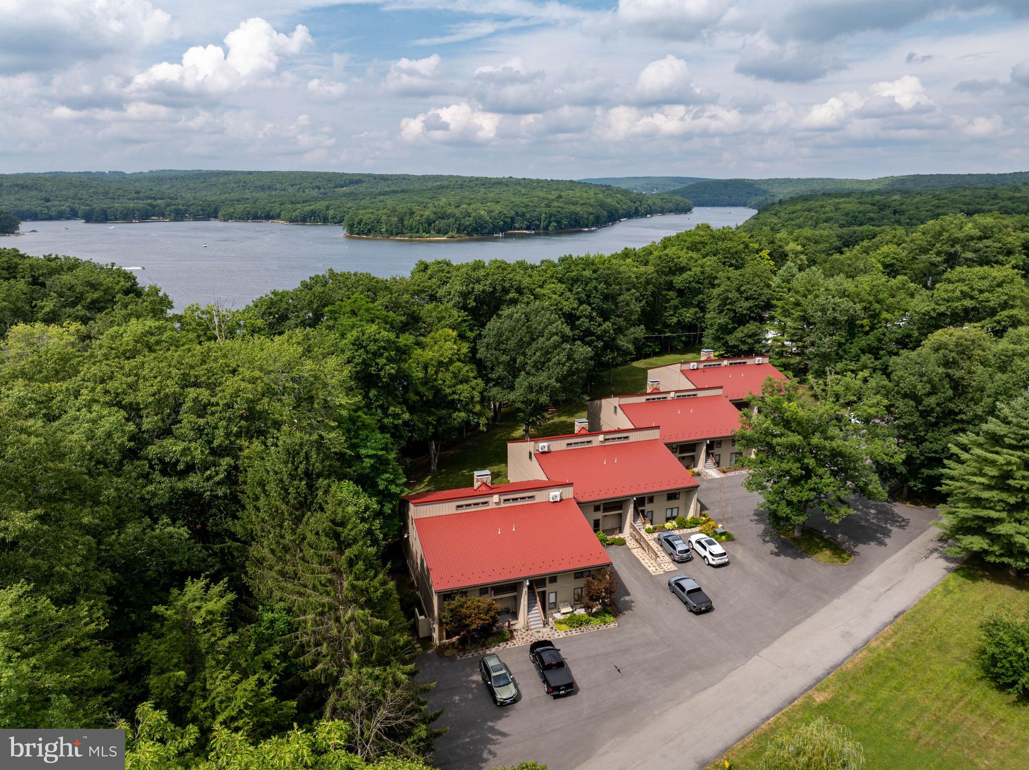 189 Red Run Road, Unit 1C2 Oakland, MD 21550 - Photo 47 of 50 an aerial view of a house with yard and outdoor seating