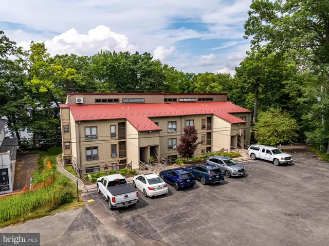 a view of a parked cars in front of a house