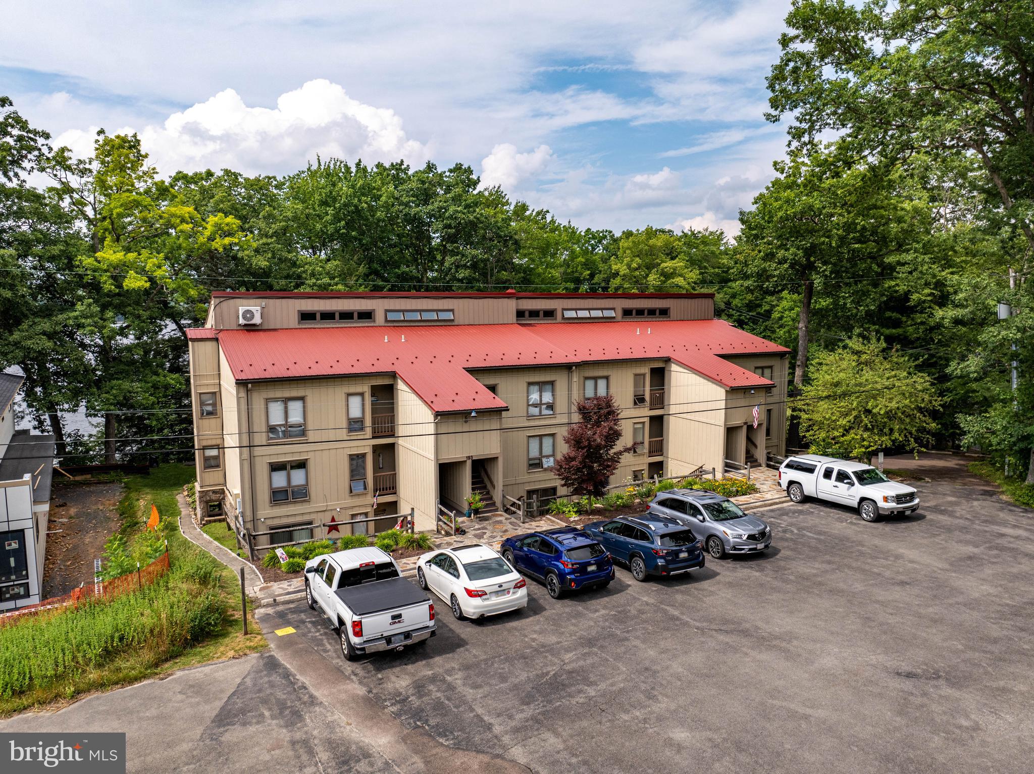 189 Red Run Road, Unit 1C2 Oakland, MD 21550 - Photo 48 of 50 a view of a parked cars in front of a house