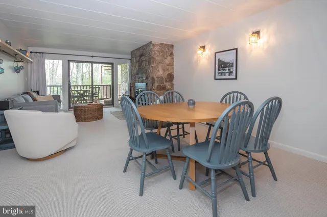 a dining room with furniture and window