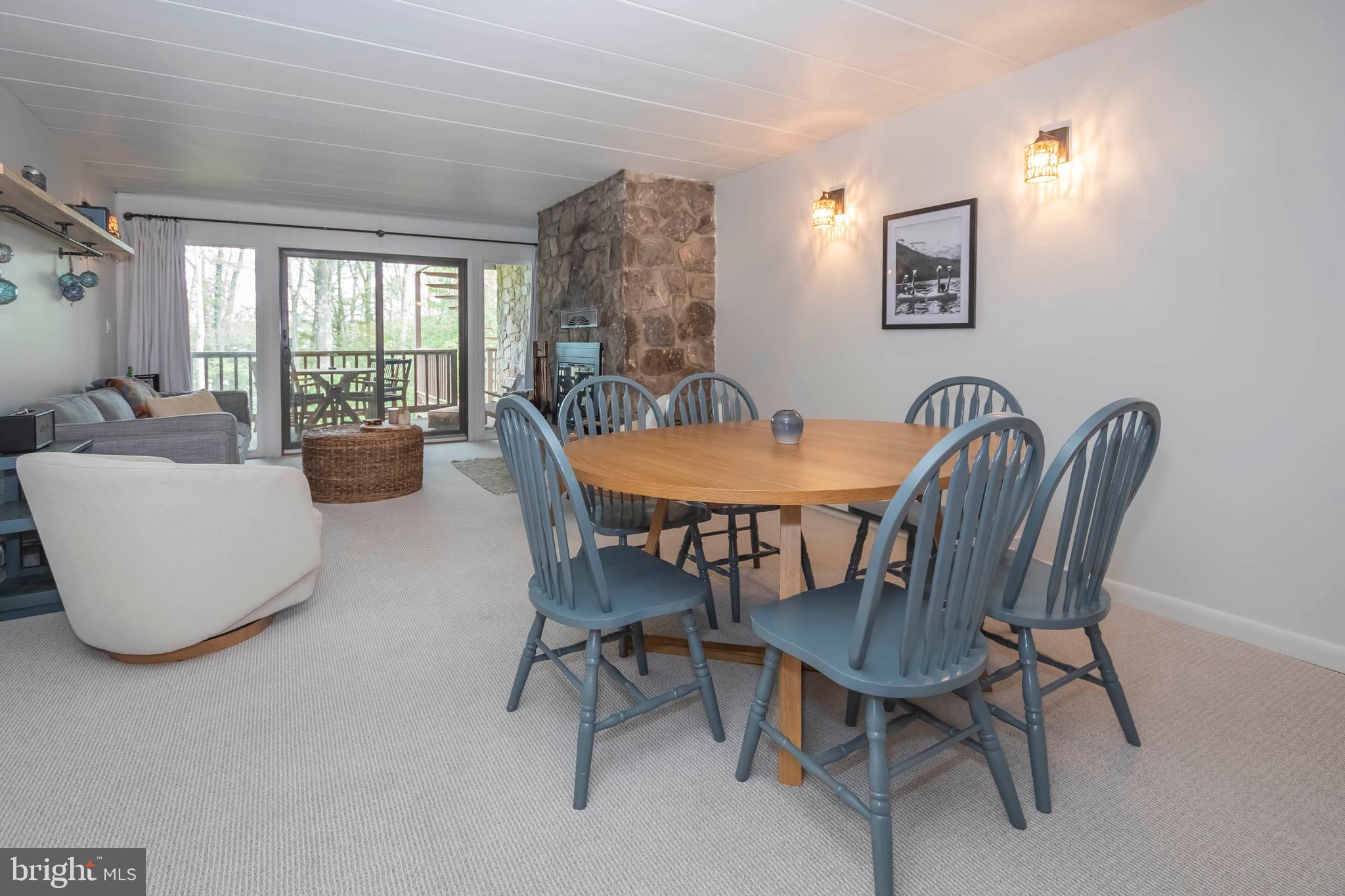 189 Red Run Road, Unit 1C2 Oakland, MD 21550 - Photo 9 of 50 a dining room with furniture and window