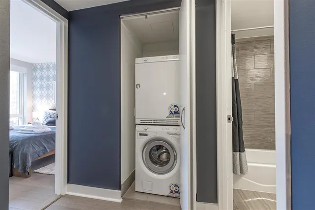 a living room view with glass door and balcony