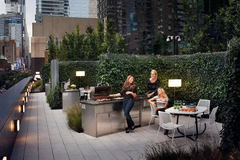 a living room with fireplace furniture and a large window