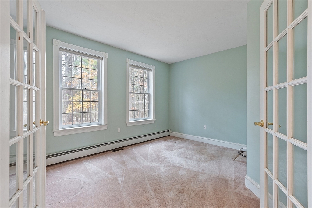 96 Cedarwood Road Boxborough, MA 01719 - Photo 11 of 41 a view of an empty room with a window