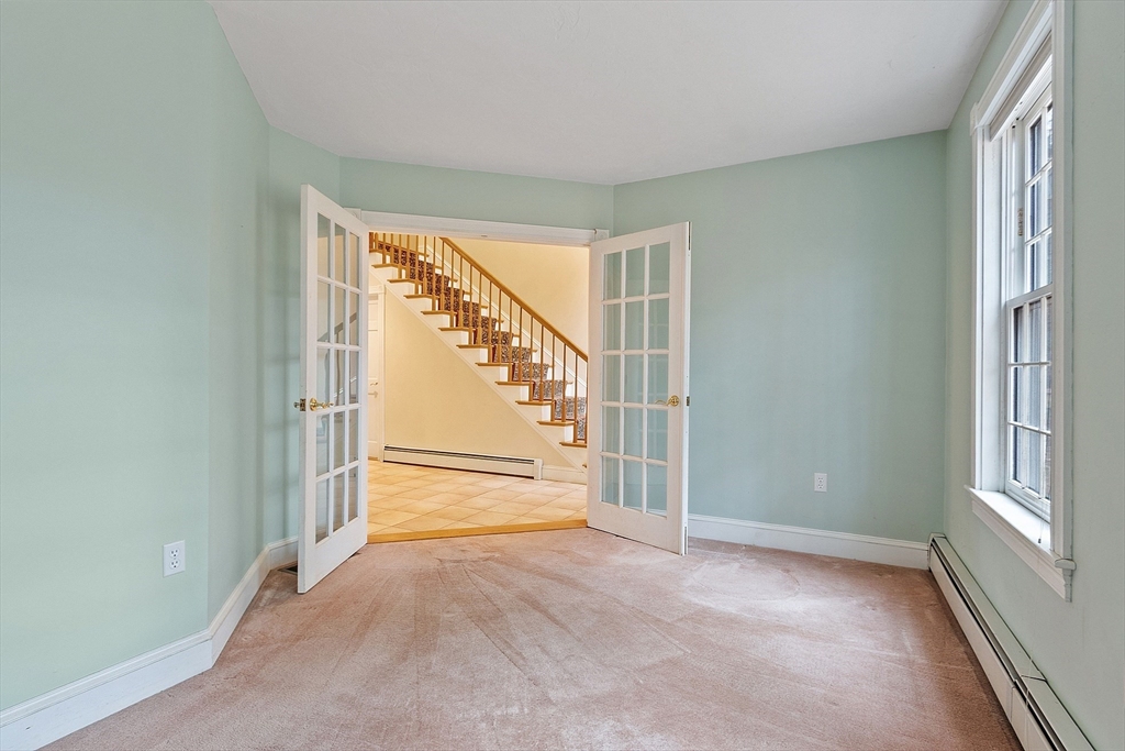 96 Cedarwood Road Boxborough, MA 01719 - Photo 12 of 41 an empty room with windows