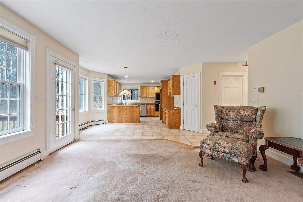 96 Cedarwood Road Boxborough, MA 01719 - Photo 13 of 41 a living room with furniture and a kitchen area