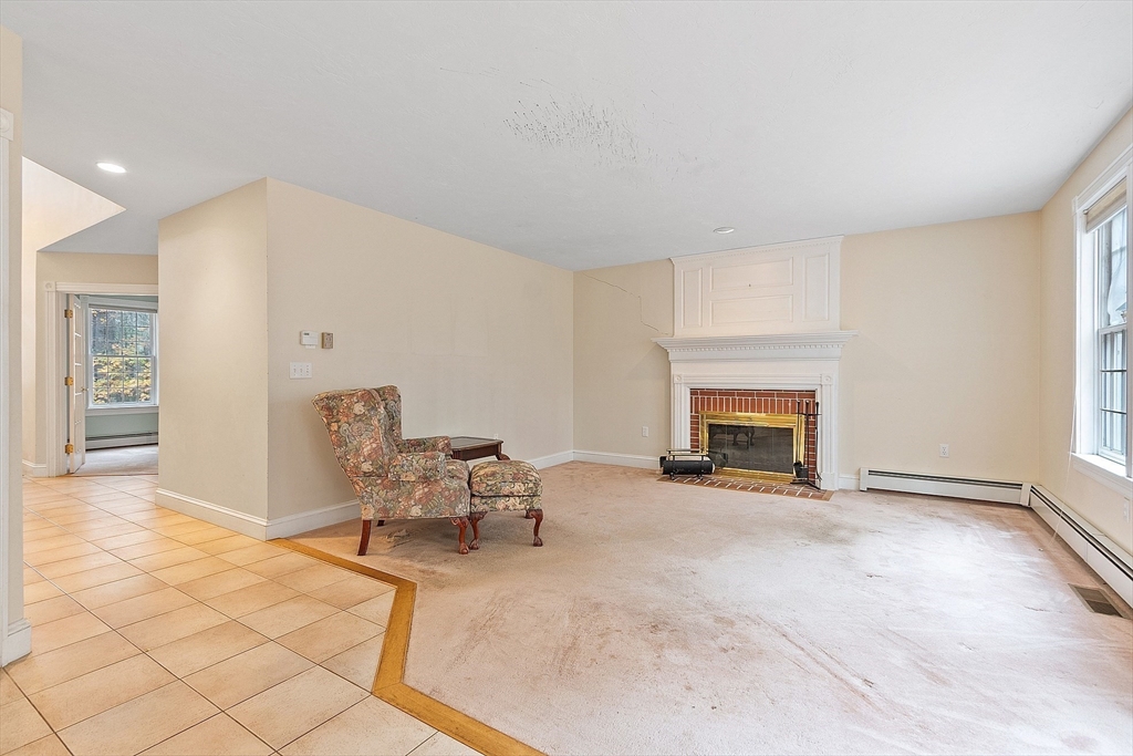 96 Cedarwood Road Boxborough, MA 01719 - Photo 14 of 41 an entryway with livingroom and a fireplace