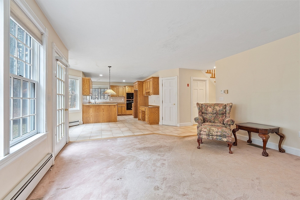 96 Cedarwood Road Boxborough, MA 01719 - Photo 15 of 41 a view of a livingroom with furniture and a kitchen