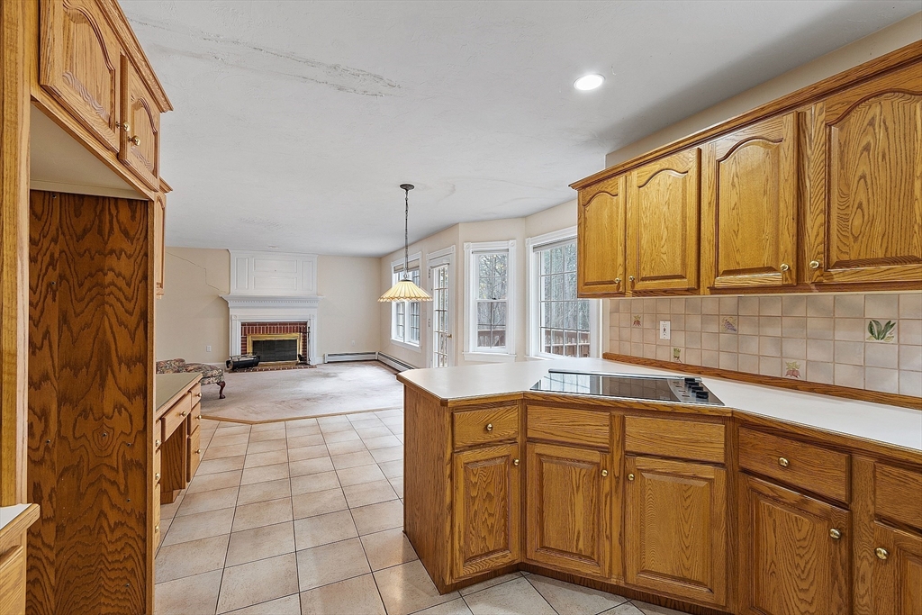 96 Cedarwood Road Boxborough, MA 01719 - Photo 19 of 41 a kitchen with stainless steel appliances a sink stove and cabinets