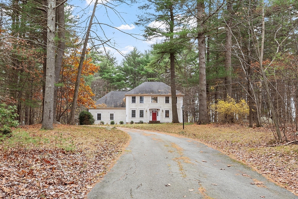96 Cedarwood Road Boxborough, MA 01719 - Photo 2 of 41 a view of a large white house with a large tree next to a building