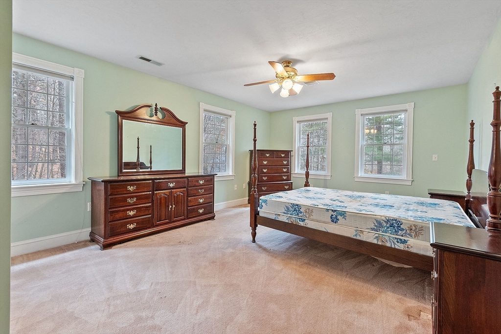 96 Cedarwood Road Boxborough, MA 01719 - Photo 22 of 41 a spacious bedroom with a bed and a dresser
